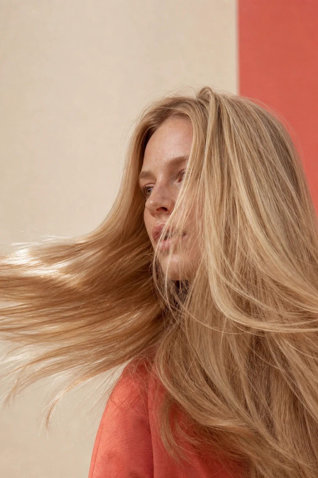 Woman with healthy blonde hair in motion